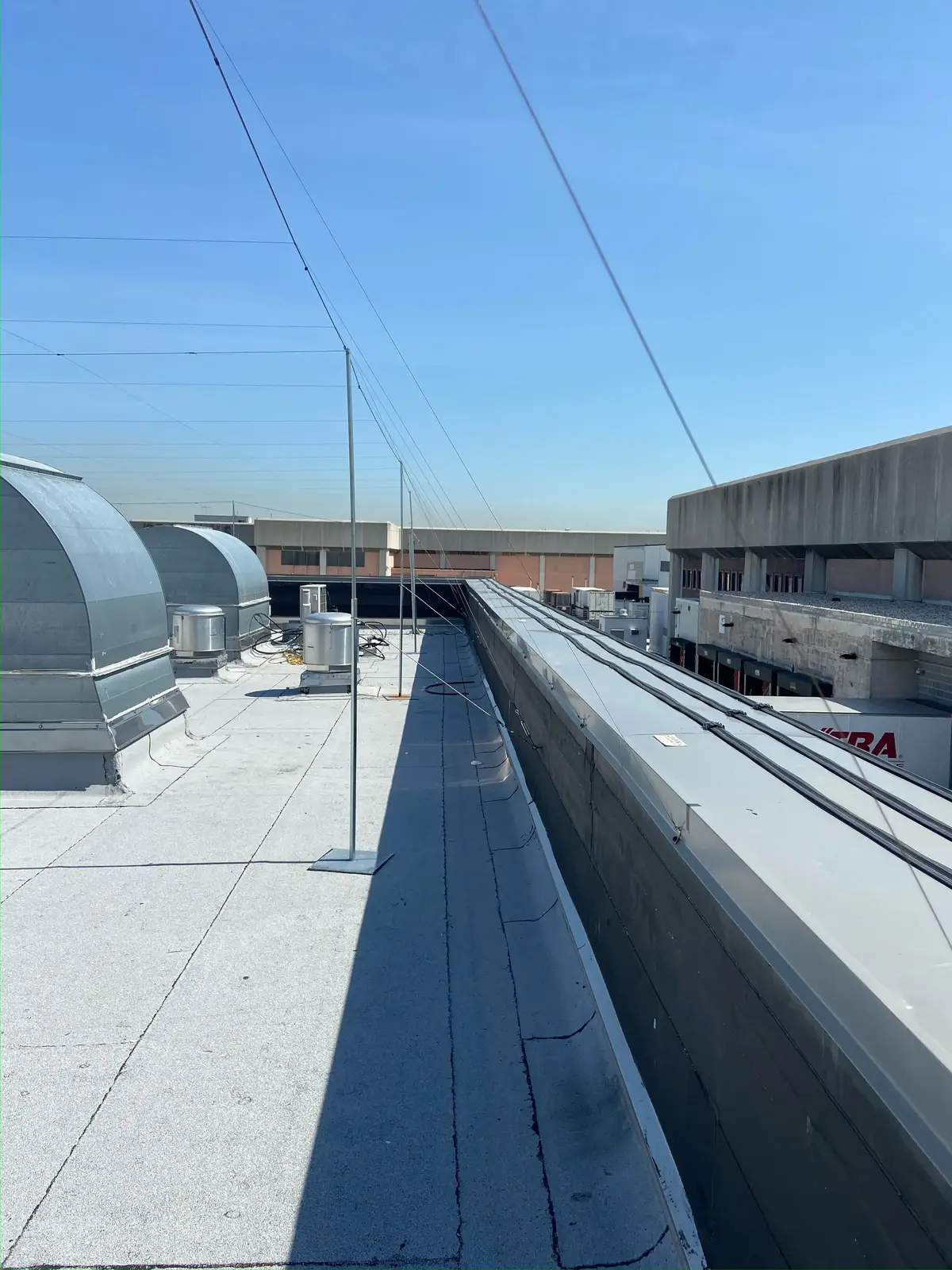 Installing a wire-grid system, structure by structure